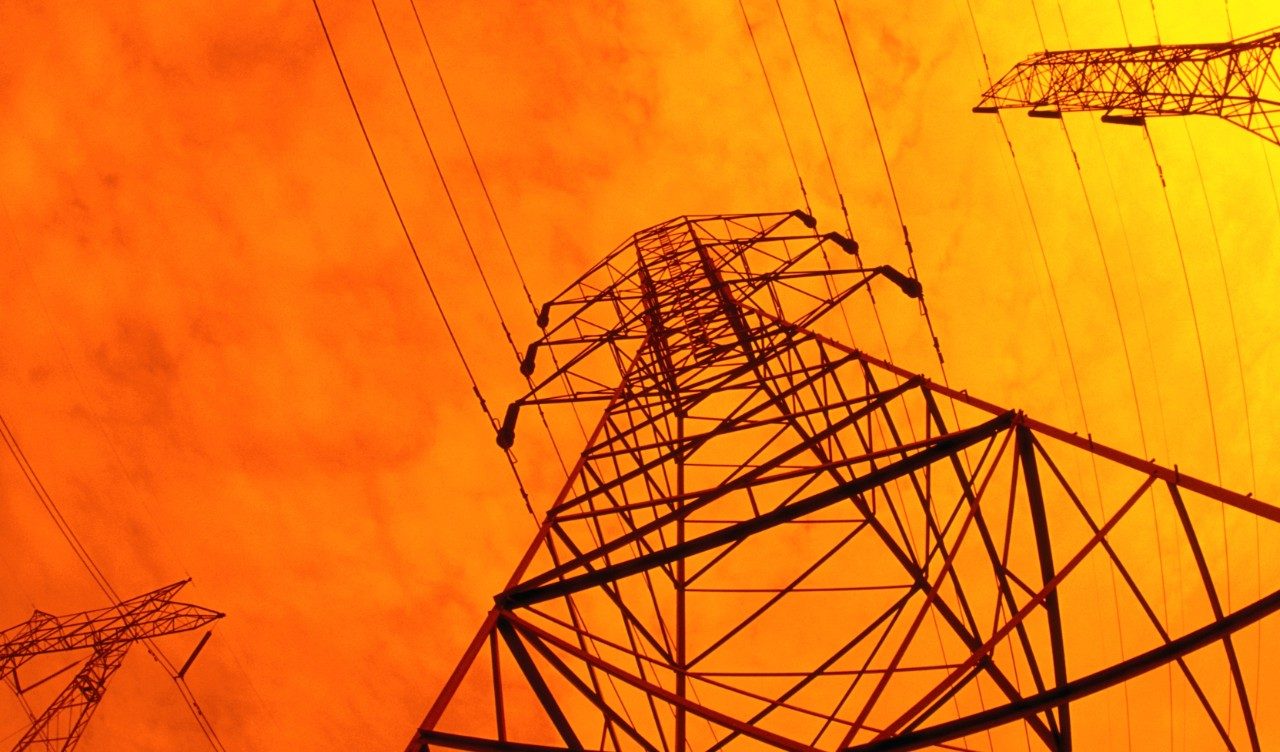 upward-view-electric-power-lines-sunset-industry.jpg